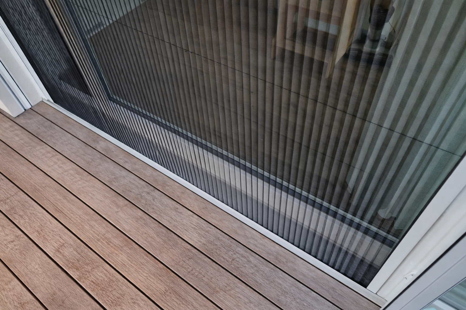 Retractable pleated fly screen on sliding door Melbourne — We Inspire Blinds